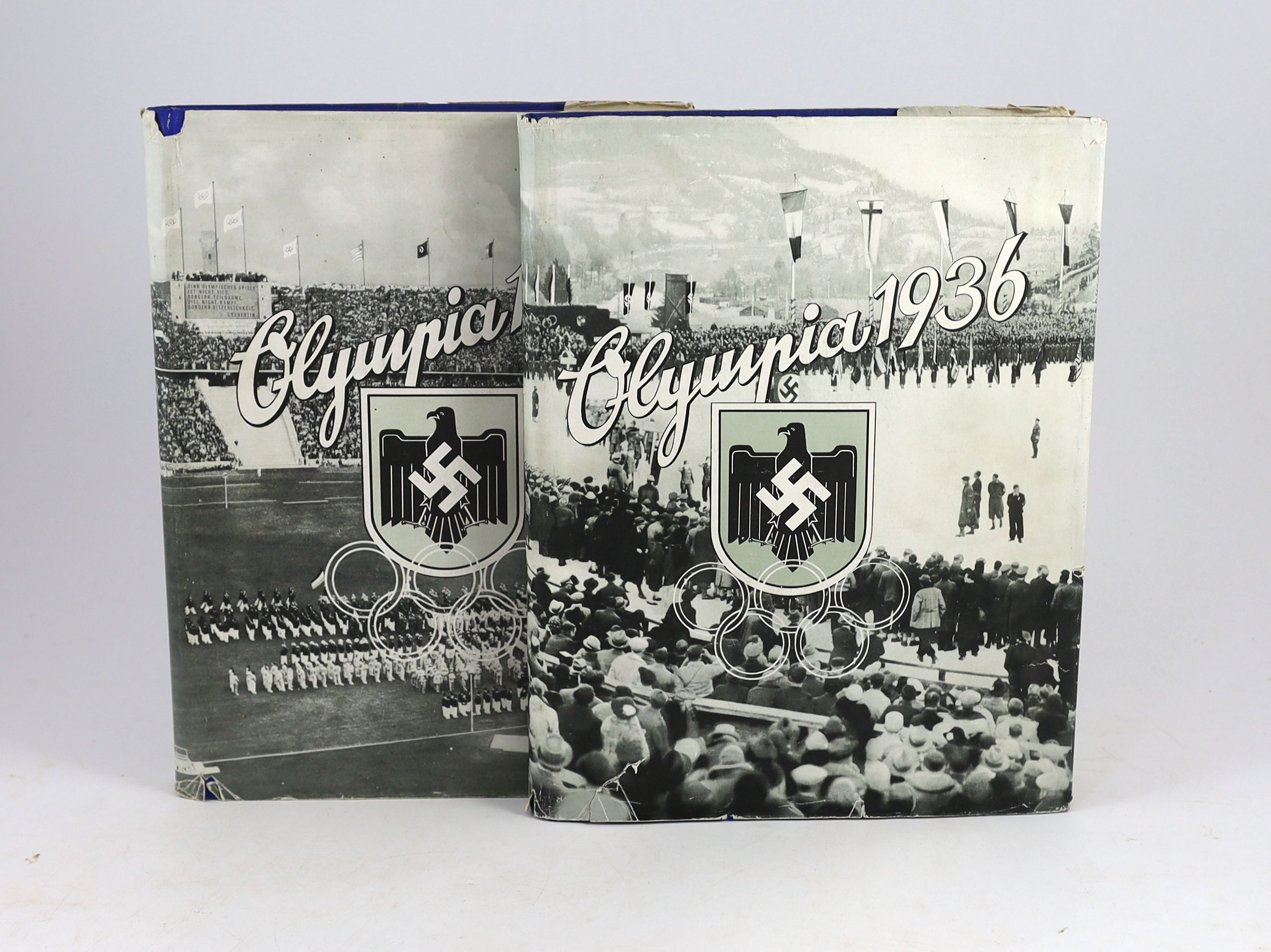 Anon - Die Olympischen Spiele 1936. 1st ed. 2. Vol. Complete with numerous illustrated plates and text illus. Original cloth with unclipped pictorial d/j. Folio. Cigaretten-Bilderdienst, Germany, 1936.